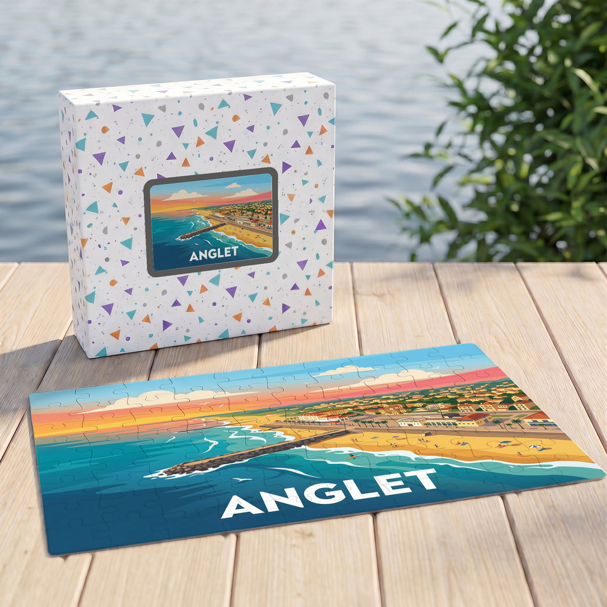 Puzzle souvenir de la ville de Anglet avec une illustration stylisée du littoral au coucher du soleil.