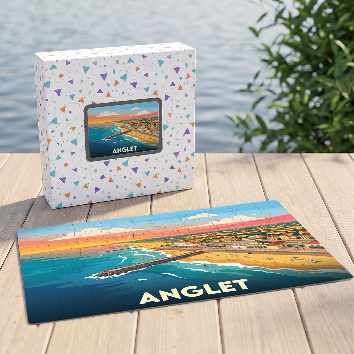Puzzle souvenir de la ville de Anglet avec une illustration stylisée du littoral au coucher du soleil.