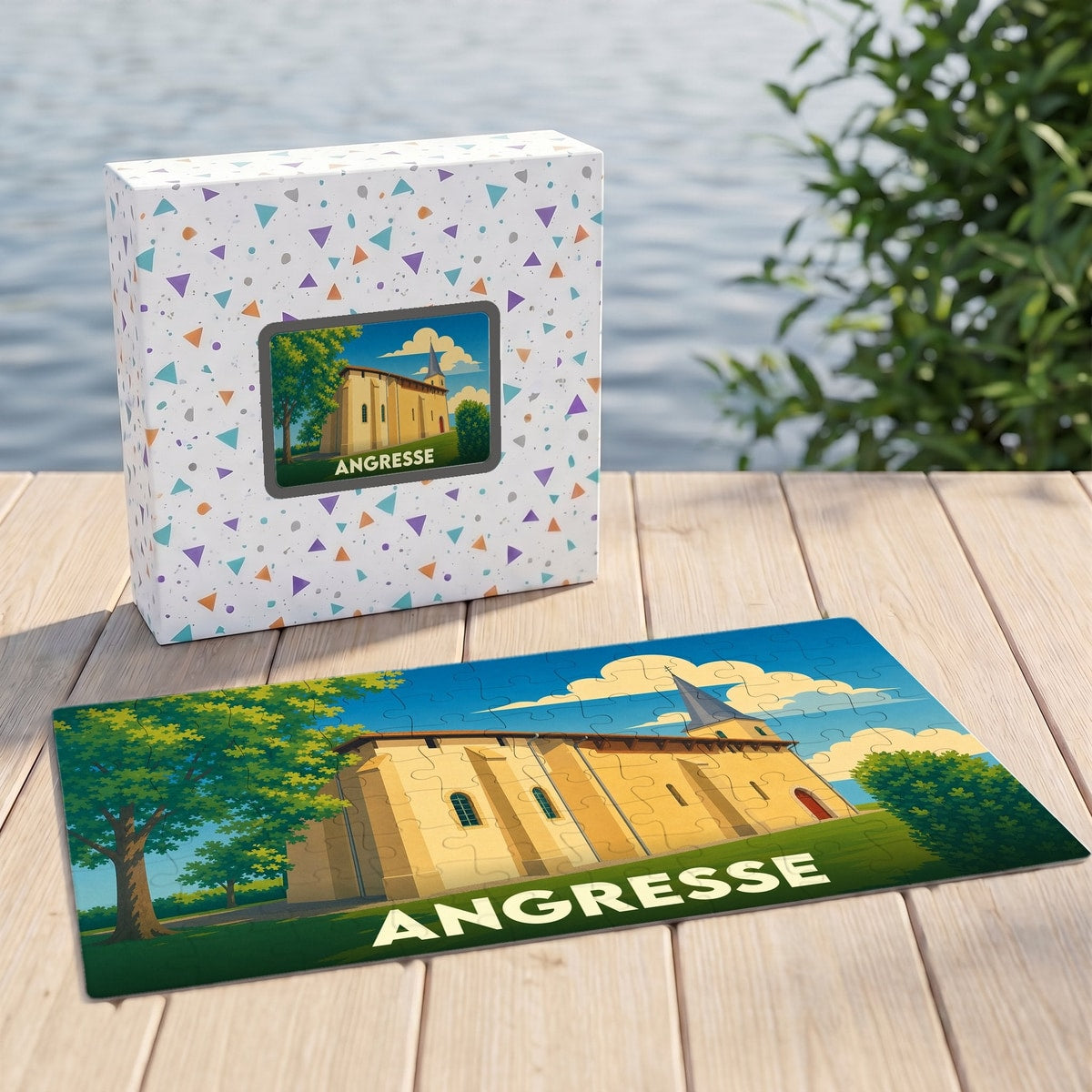 Puzzle souvenir de la ville d'Angresse avec une illustration stylisée d'une église sur sa boîte et ses pièces assemblées.