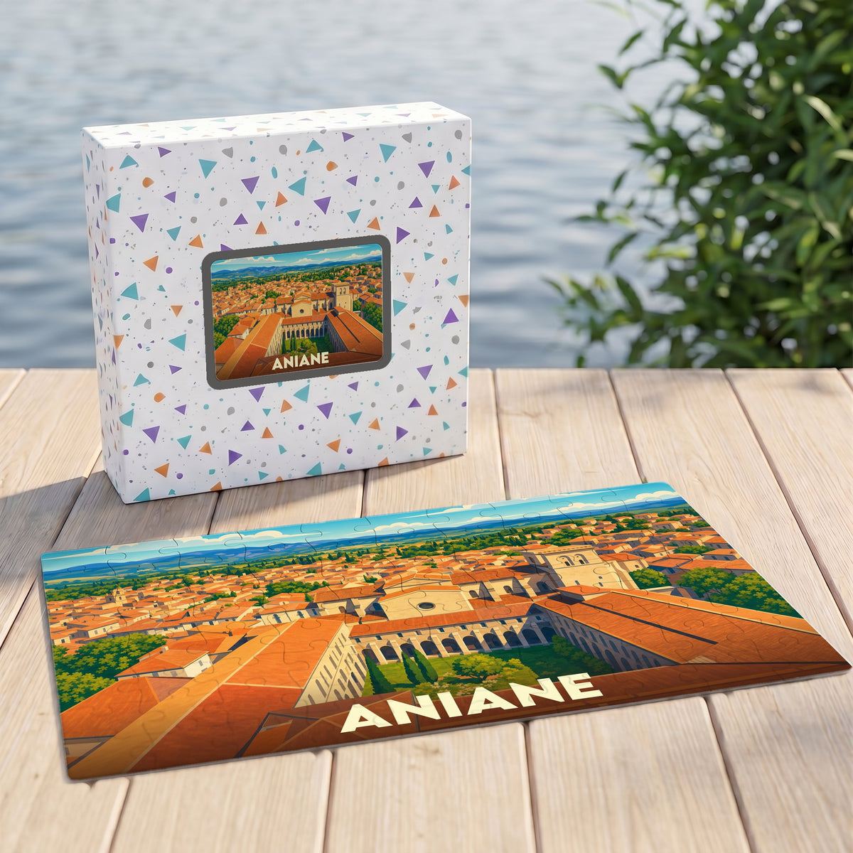 Puzzle souvenir de la ville d'Aniane avec une illustration panoramique stylisée.