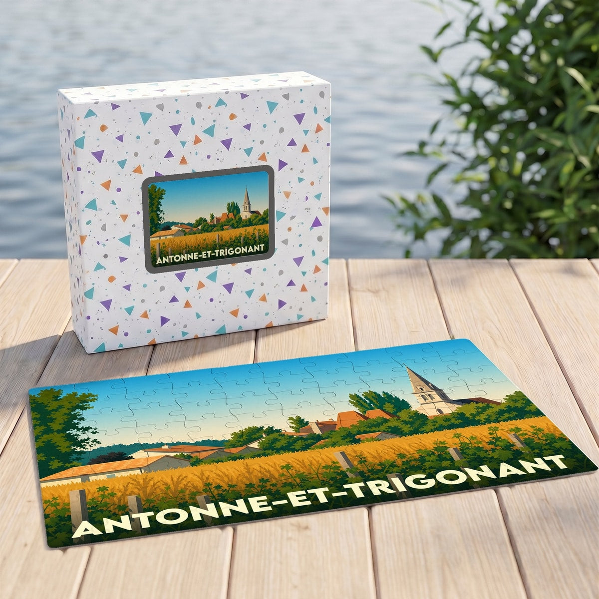 Puzzle souvenir de la ville de Antonne-et-Trigonant avec une illustration stylisée d'un paysage rural.