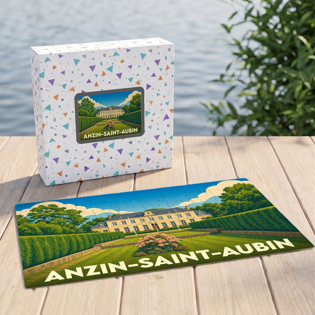 Puzzle souvenir de la ville d'Anzin-Saint-Aubin illustré par un manoir entouré de jardins.