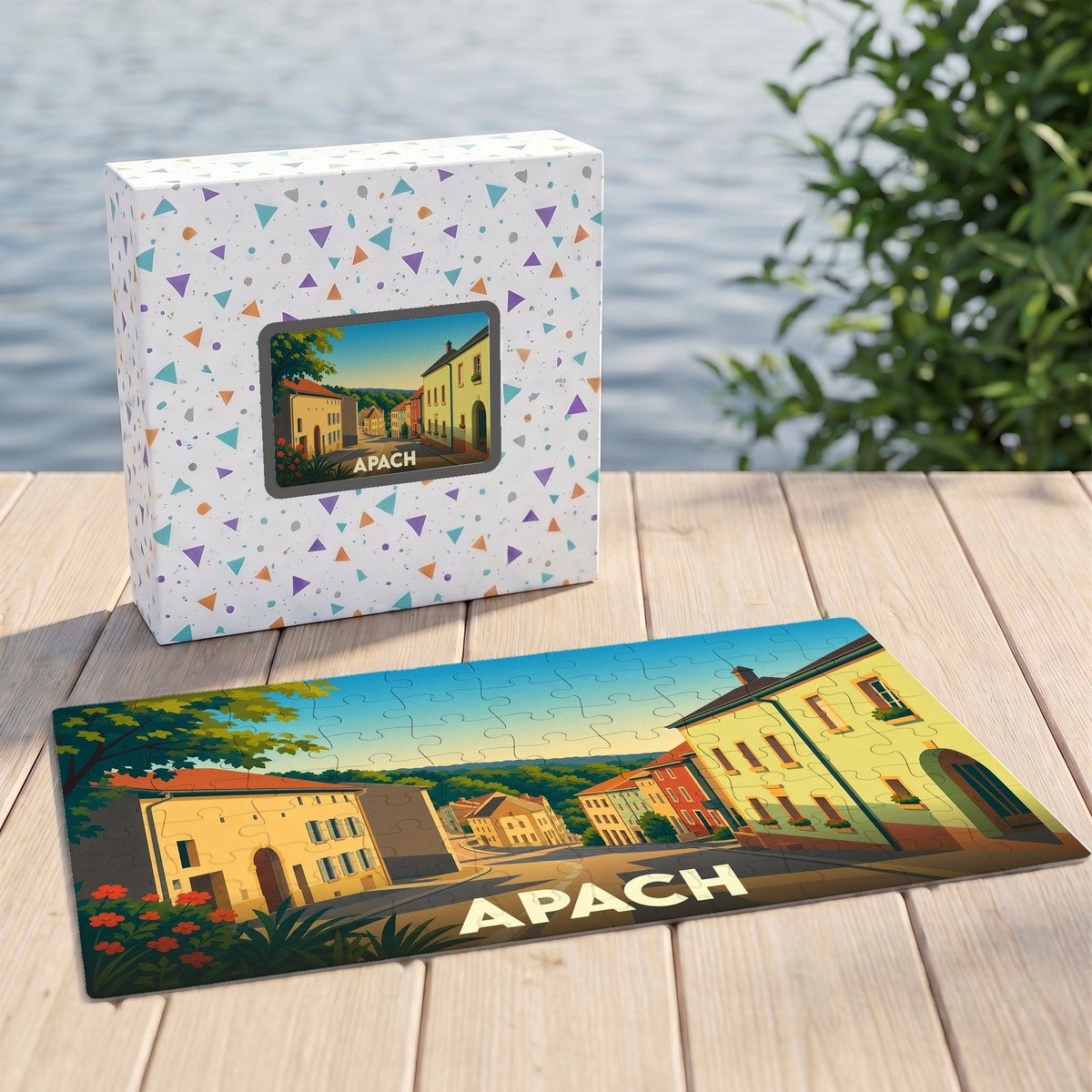 Puzzle souvenir de la ville d'Apach avec une illustration stylisée d'un paysage urbain coloré.