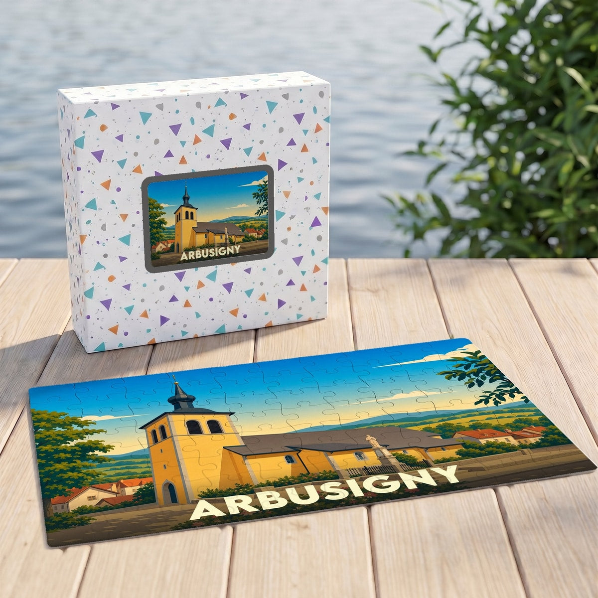 Puzzle souvenir de la ville d'Arbusigny présentant une illustration stylisée de son église et de son paysage.