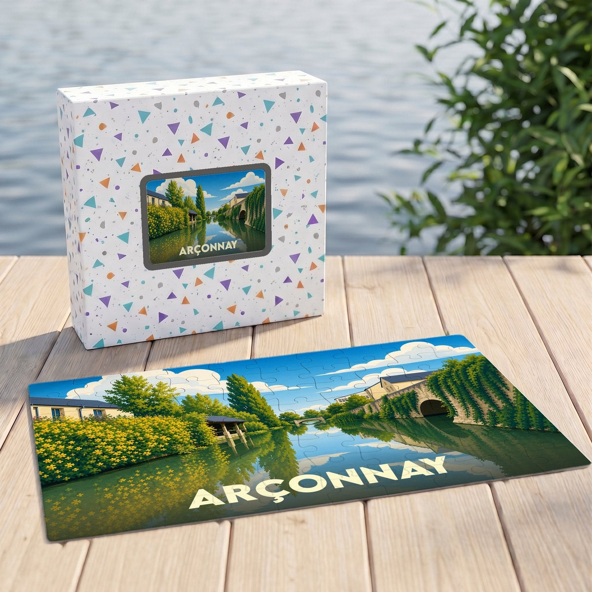 Puzzle souvenir de la ville d'Arçonnay avec une illustration stylisée représentant un paysage de rivière calme.