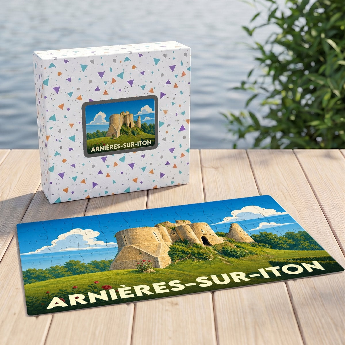 Puzzle souvenir de la ville d'Arnières-sur-Iton avec une illustration stylisée d'un château médiéval.