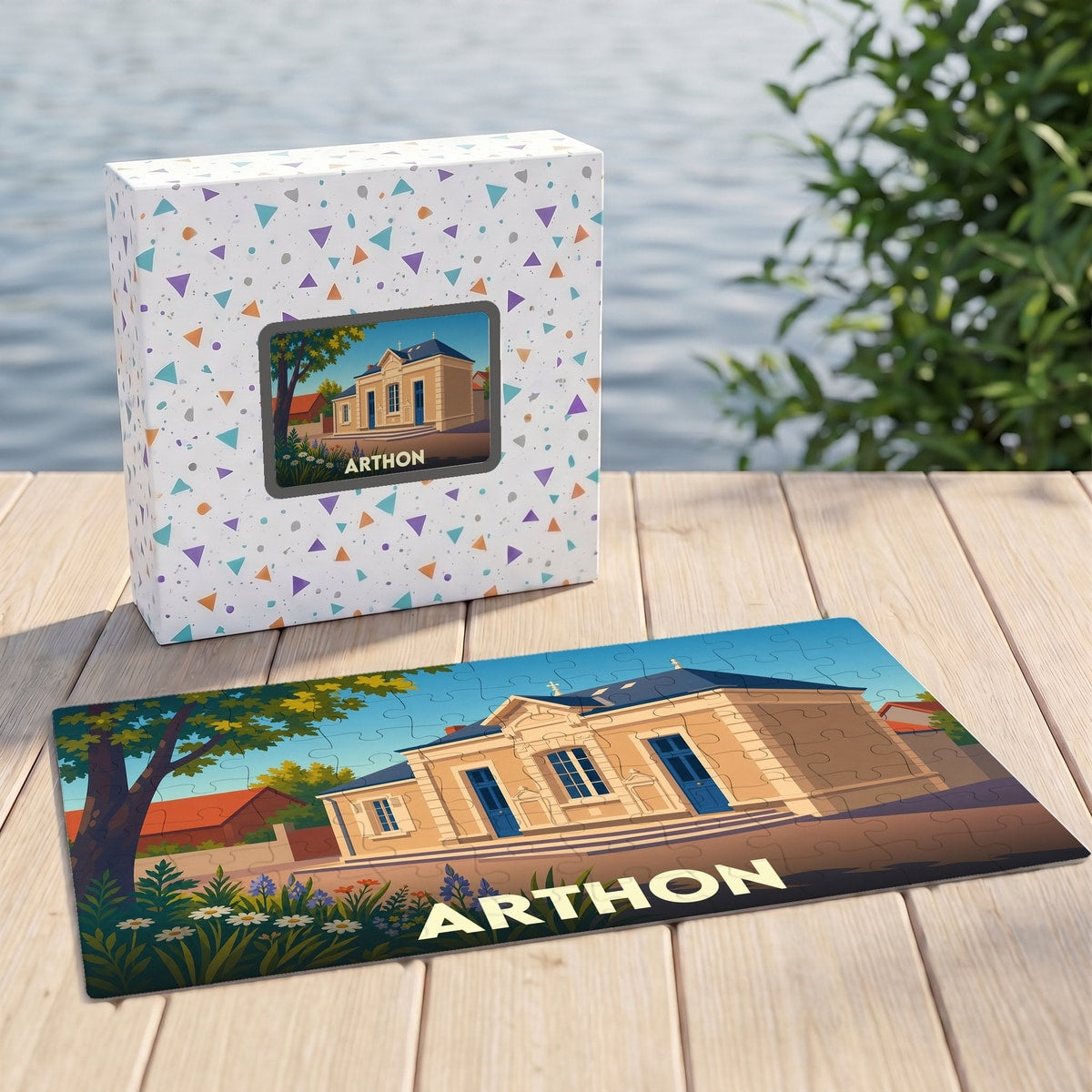 Puzzle souvenir de la ville d'Arthon avec une illustration stylisée d'un bâtiment historique.