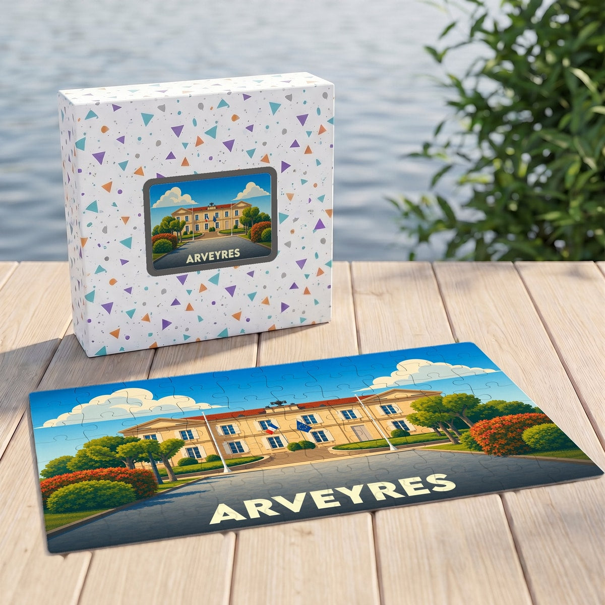 Puzzle souvenir de la ville d'Arveyres présentant une illustration stylisée de son hôtel de ville devant sa boîte assortie.