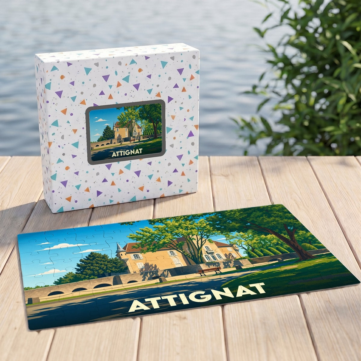 Puzzle souvenir de la ville d'Attignat présentant une illustration stylisée de son patrimoine architectural.