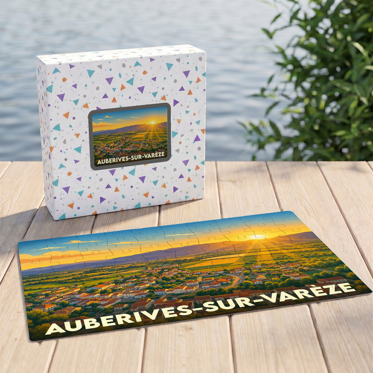 Puzzle souvenir de la ville d'Auberives-sur-Varèze avec une illustration stylisée d'un paysage au soleil couchant.
