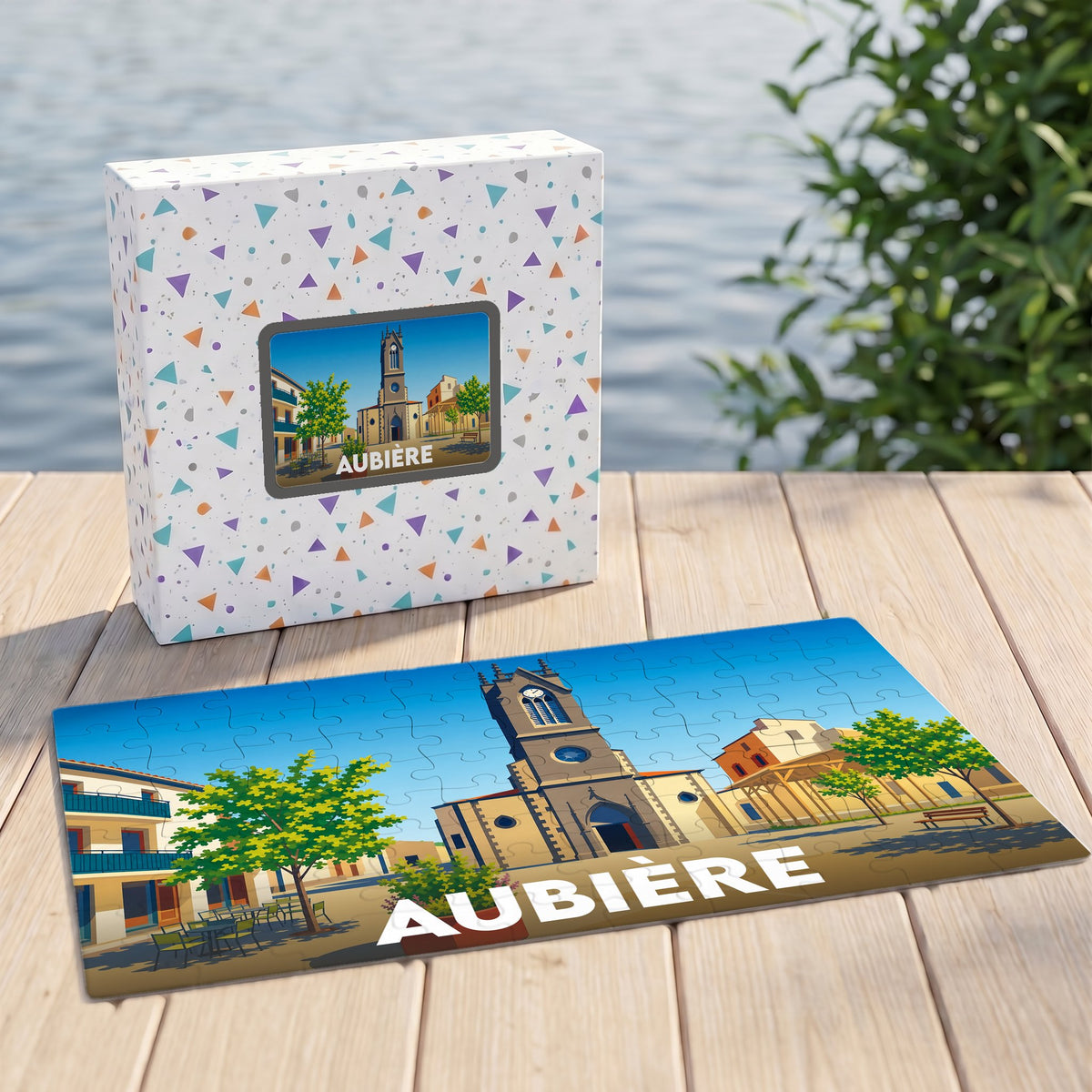 Puzzle souvenir de la ville d'Aubière avec une illustration stylisée d'une place ensoleillée.