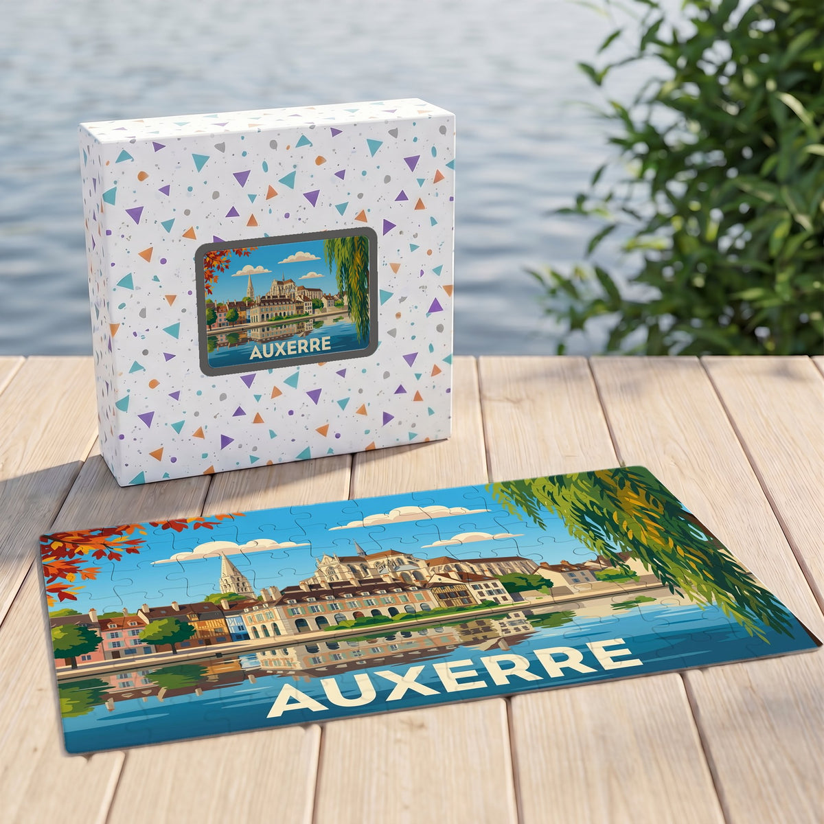 Puzzle souvenir de la ville d'Auxerre avec une illustration stylisée et sa boîte assortie.