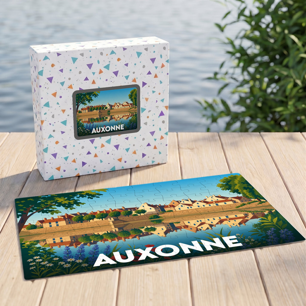 Puzzle souvenir de la ville d'Auxonne avec une illustration stylisée d'un paysage urbain au bord de l'eau.