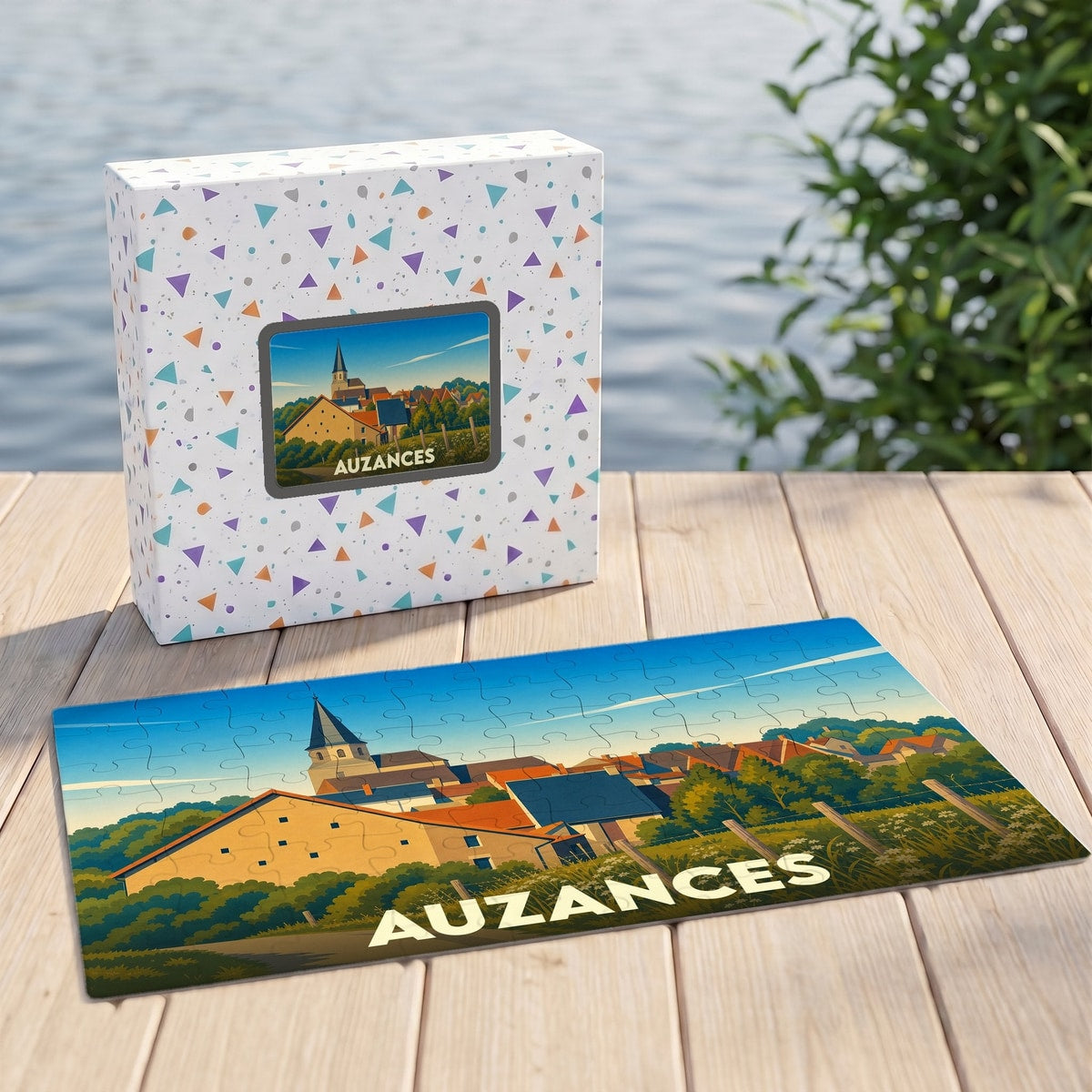 Puzzle souvenir de la ville d'Auzances avec une illustration stylisée d'un paysage urbain.