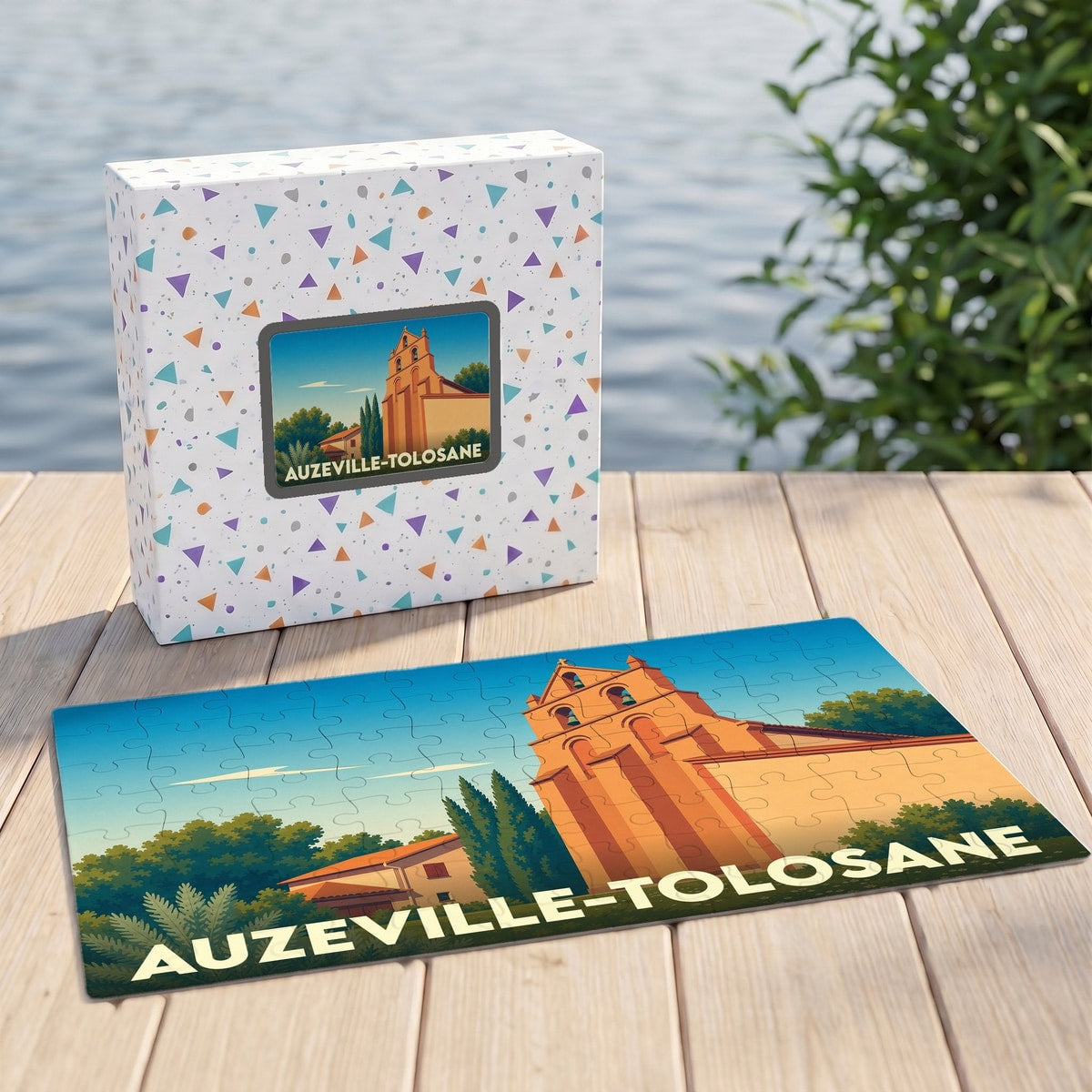 Puzzle souvenir de la ville d'Auzeville-Tolosane avec son carton d'emballage assorti et une illustration stylisée.