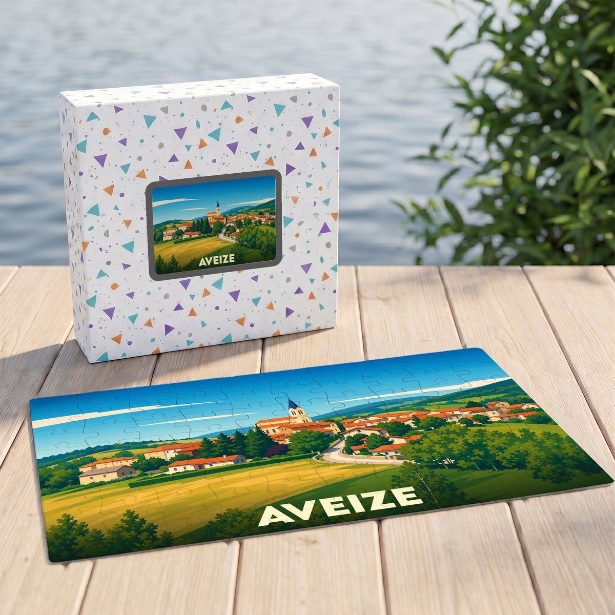 Puzzle souvenir de la ville d'Aveize avec une illustration stylisée d'un paysage de campagne.