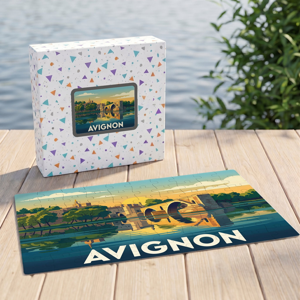 Puzzle souvenir de la ville d'Avignon avec une illustration stylisée de son célèbre pont au coucher du soleil.