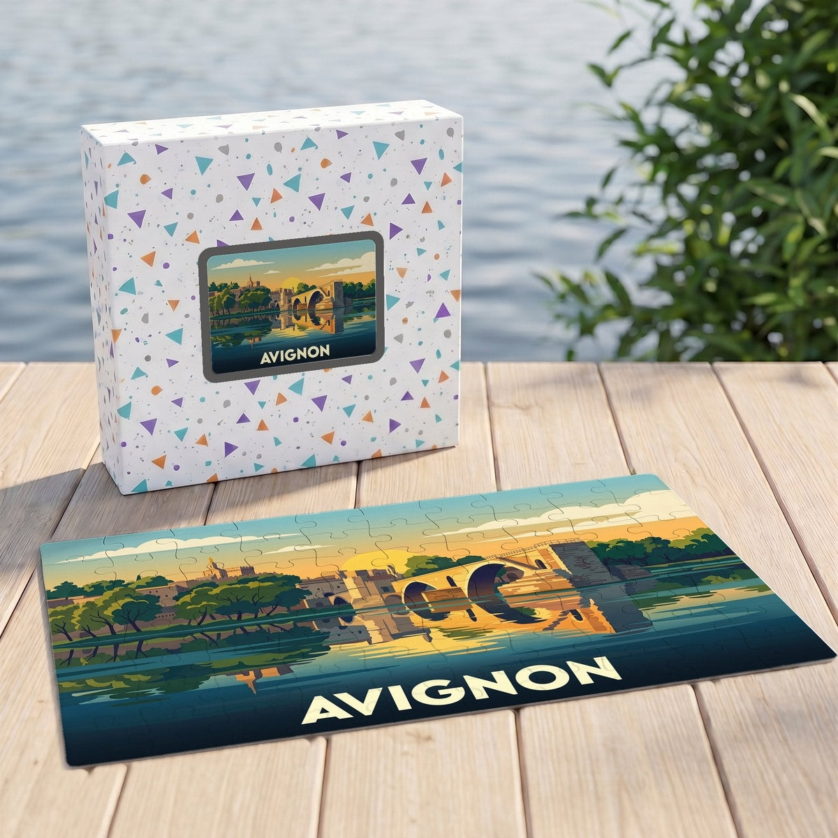 Puzzle souvenir de la ville d'Avignon avec une illustration stylisée de son célèbre pont au coucher du soleil.