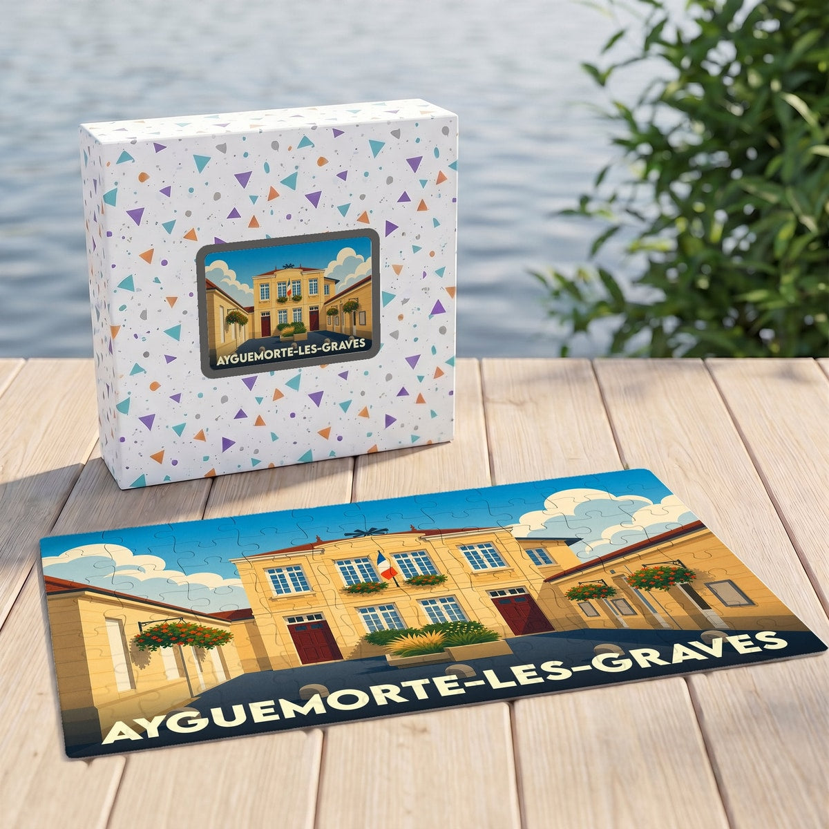 Puzzle souvenir de la ville d'Ayguemorte-les-Graves avec une illustration stylisée de sa mairie.