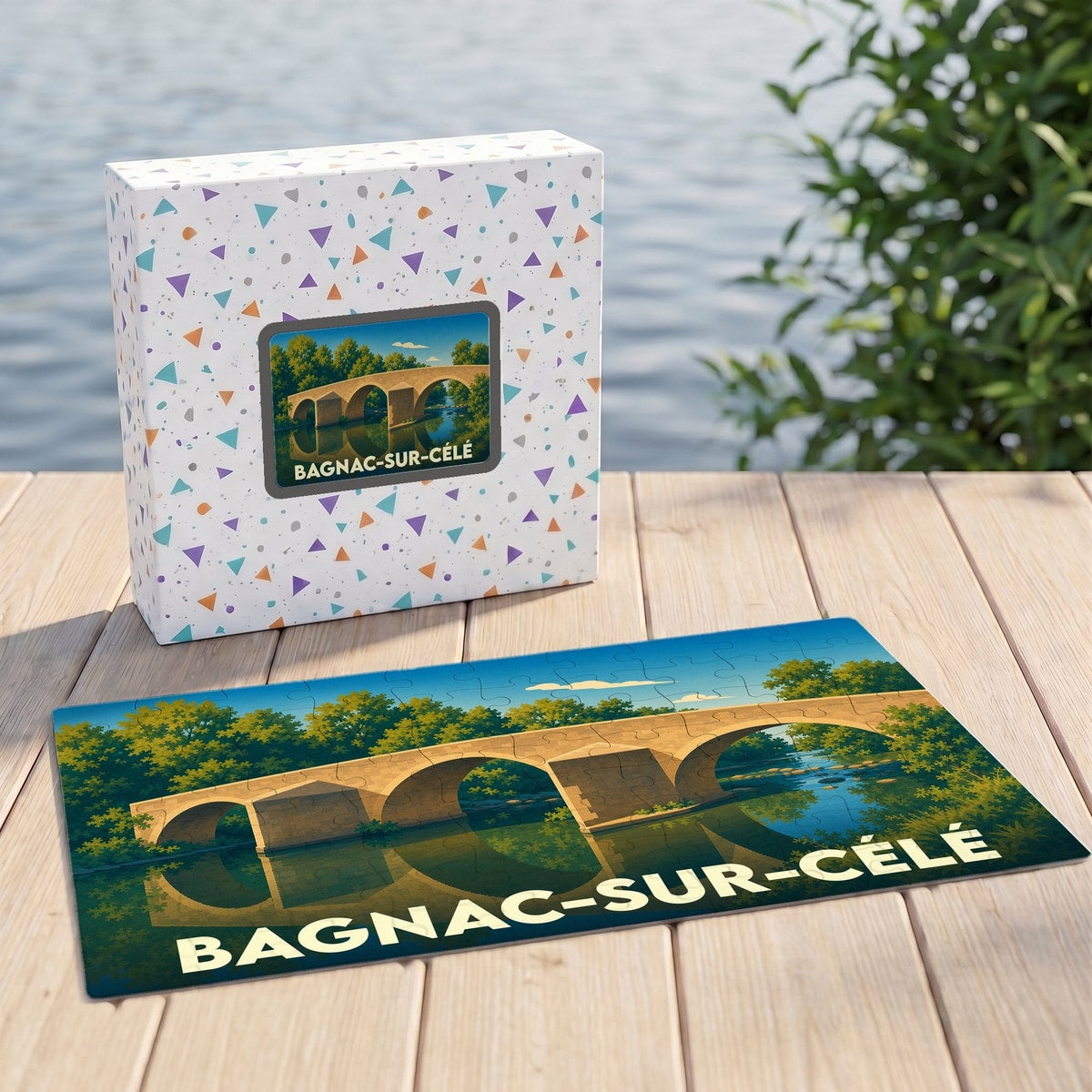 Puzzle souvenir de la ville de Bagnac-sur-Célé représentant un pont en pierre sur une rivière avec son reflet.