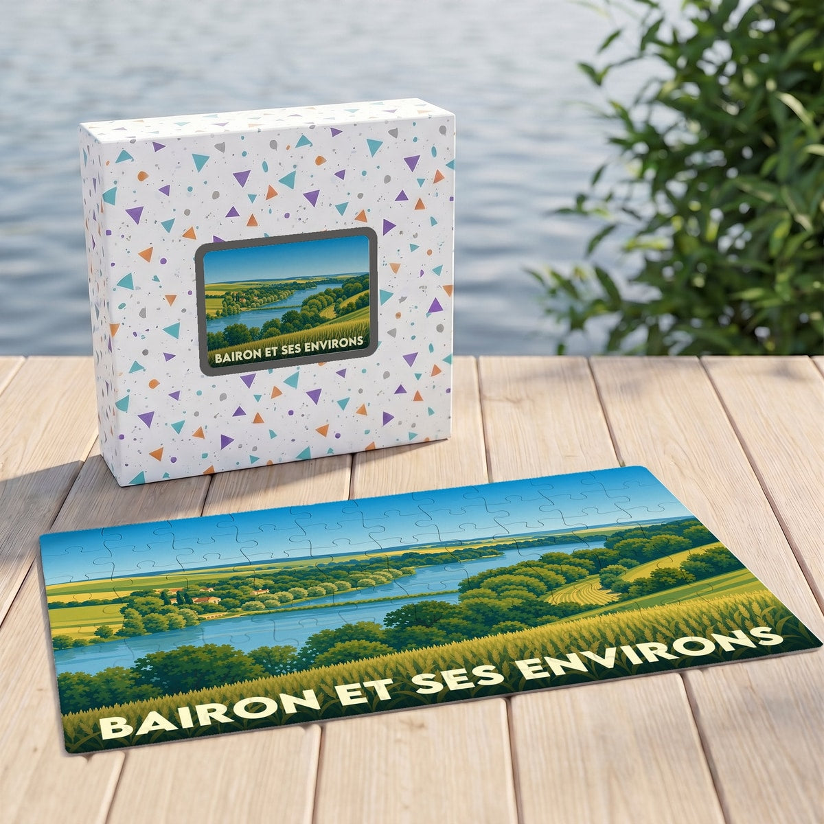 Puzzle souvenir du Lac de Bairon et ses environs avec une illustration de paysage vallonné.