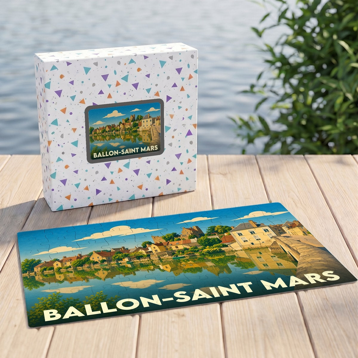 Puzzle souvenir de la ville de Ballon-Saint Mars illustré par un paysage urbain au bord de l'eau.