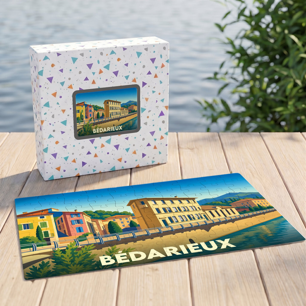 Puzzle souvenir de la ville de Bédarieux illustrant ses quais colorés au bord de l'eau.