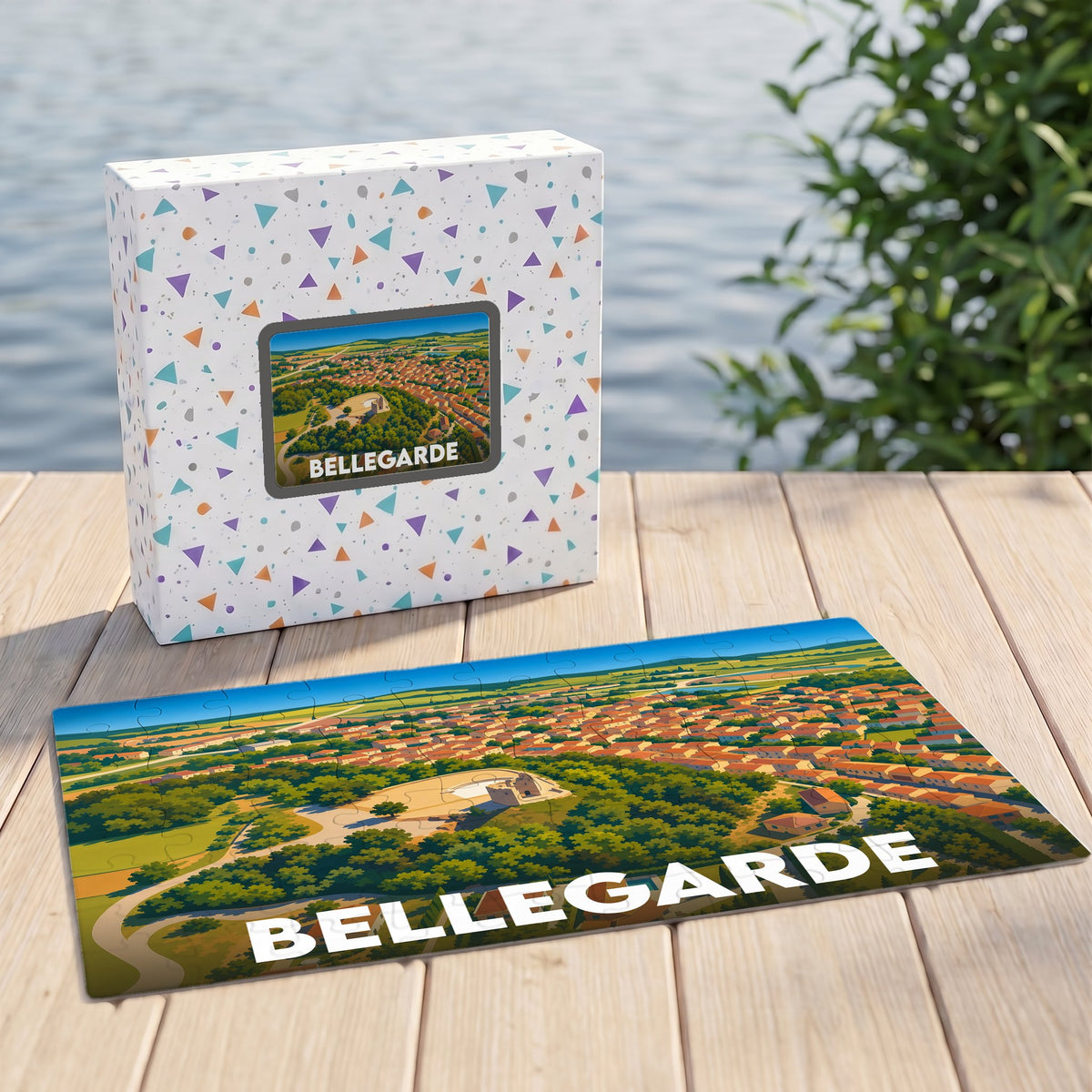 Puzzle souvenir de la ville de Bellegarde présenté avec sa boîte et une illustration stylisée de type paysage urbain.