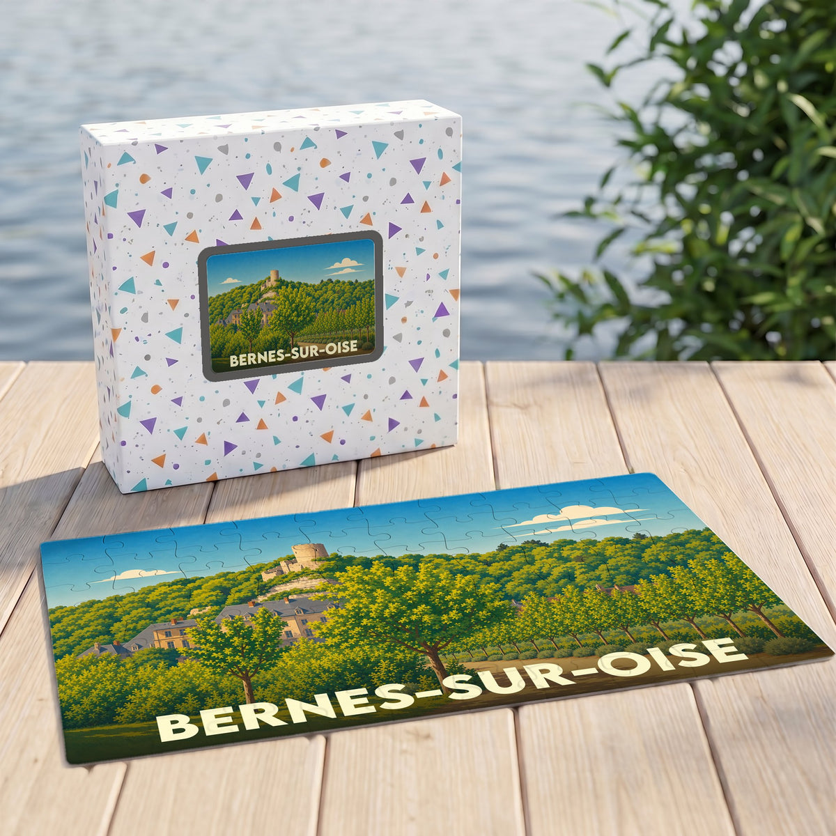 Puzzle souvenir de la ville de Bernes-sur-Oise avec son emballage et une illustration paysagère stylisée.