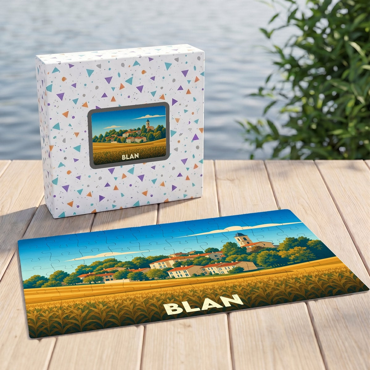 Puzzle souvenir de la ville de Blan illustrant un paysage champêtre stylisé.