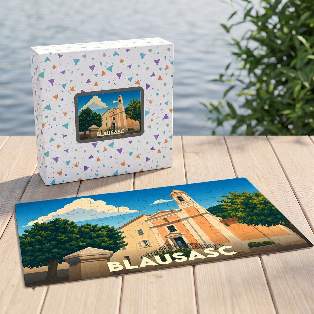 Puzzle souvenir de la ville de Blausasc avec une illustration stylisée de son église et de son clocher.