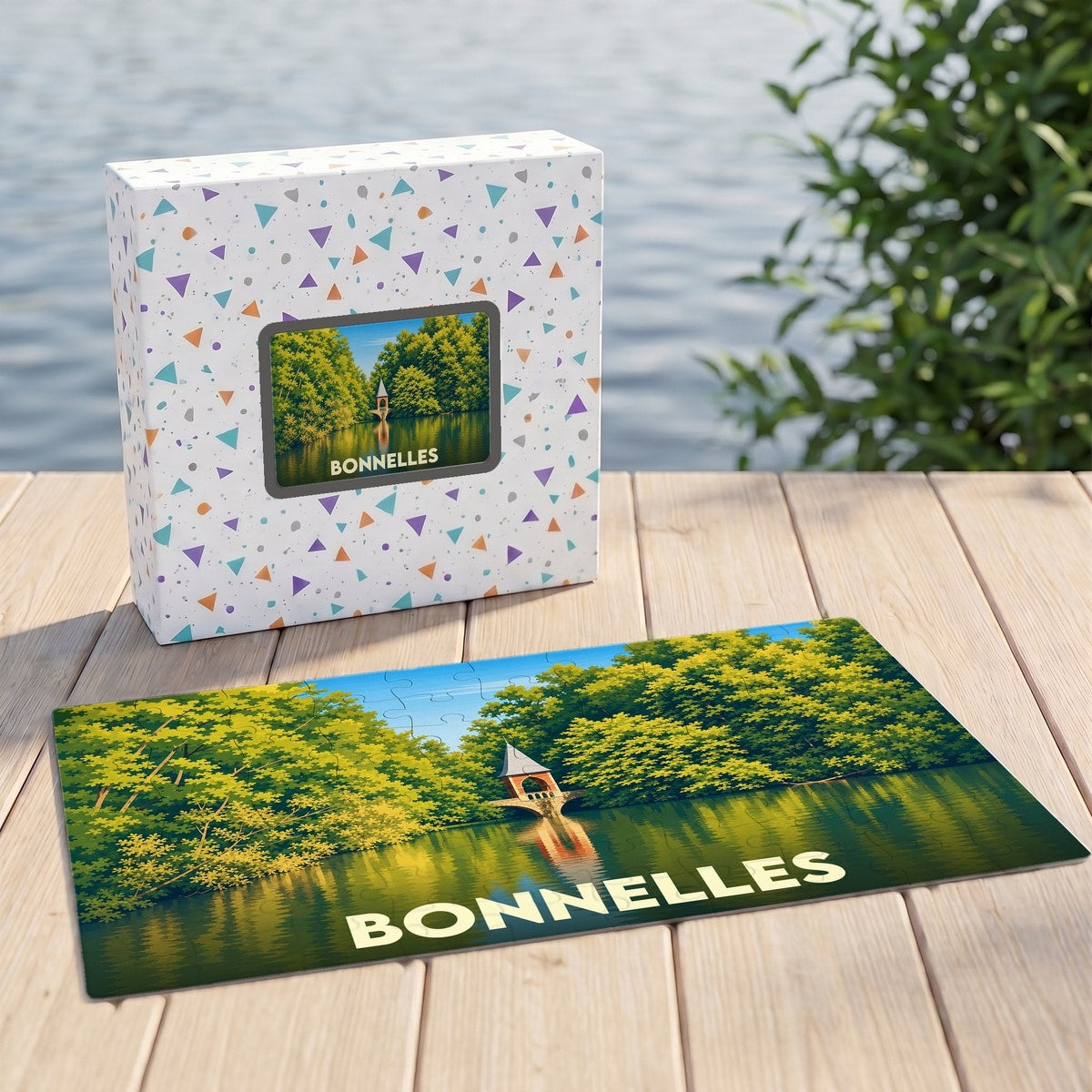 Puzzle souvenir de la ville de Bonnelles avec une illustration stylisée d'un plan d'eau et sa boîte assortie.