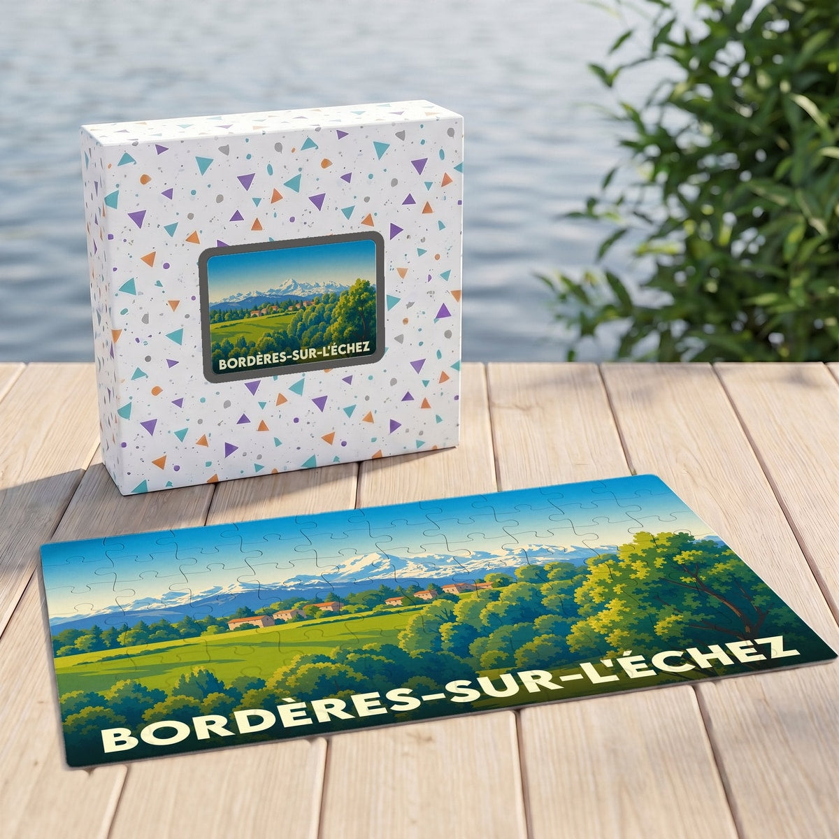 Puzzle souvenir de la ville de Bordères-sur-l'Échez avec une illustration stylisée de paysages vallonnés et montagneux.