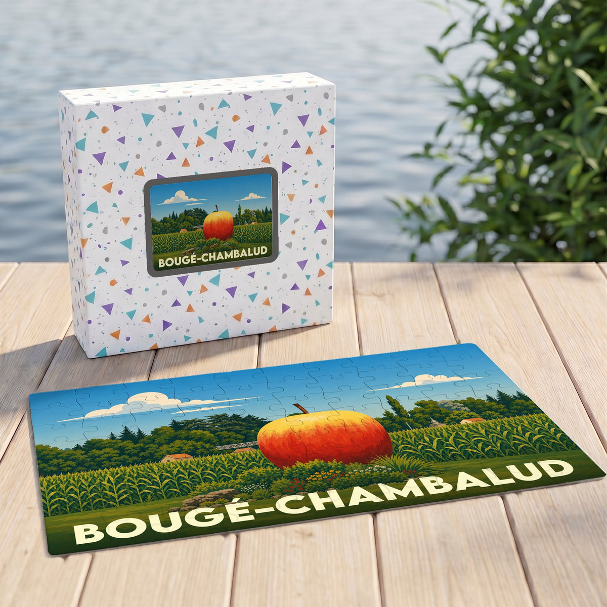 Puzzle souvenir de la ville de Bougé-Chambalud avec une illustration stylisée d'une pomme géante dans un champ.