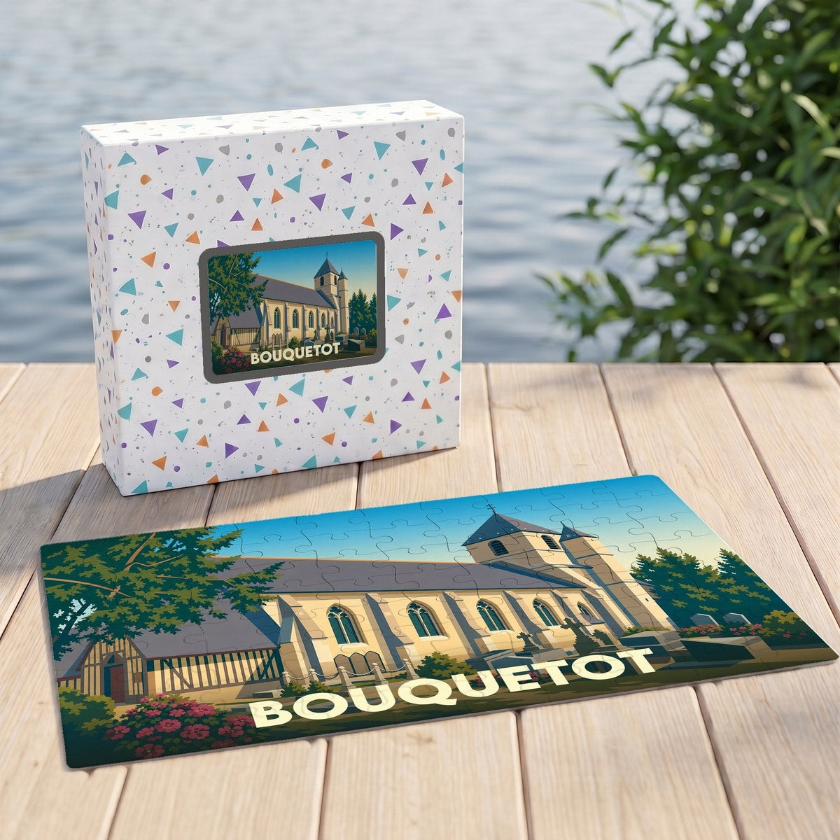 Puzzle souvenir de la ville de Bouquetot illustré d'un dessin stylisé de son église, présenté avec sa boîte assortie.