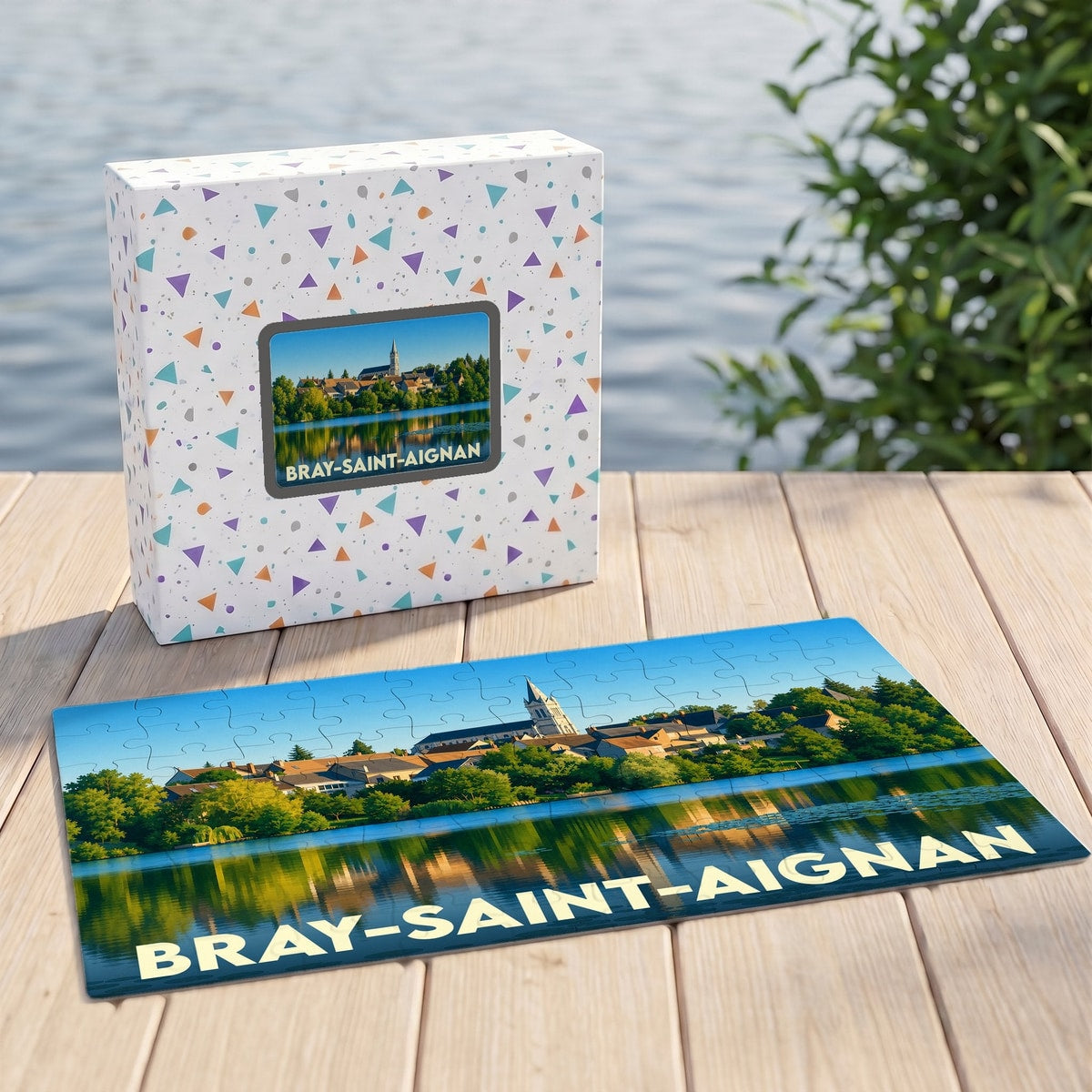 Puzzle souvenir de la ville de Bray-Saint-Aignan illustrant un paysage de bord de l'eau avec son église.