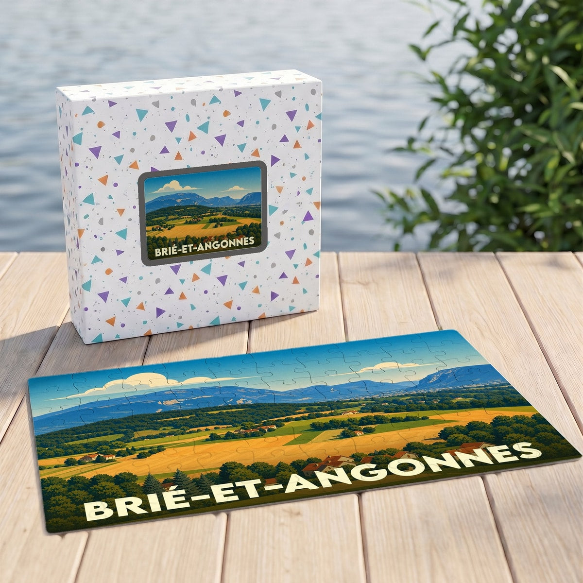 Puzzle souvenir de la ville de Brié-et-Angonnes avec une illustration stylisée de paysages vallonnés.