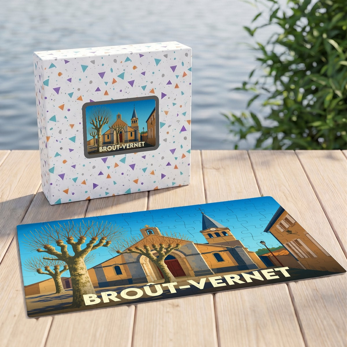 Puzzle souvenir de la ville de Broût-Vernet avec une illustration stylisée de son église et de ses arbres.