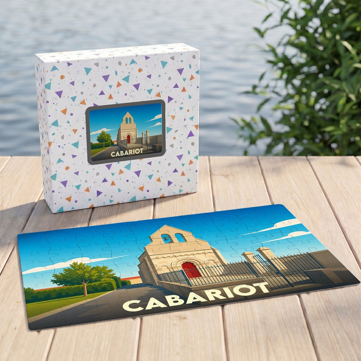 Puzzle souvenir de la ville de Cabariot représentant une église stylisée sous un ciel bleu.