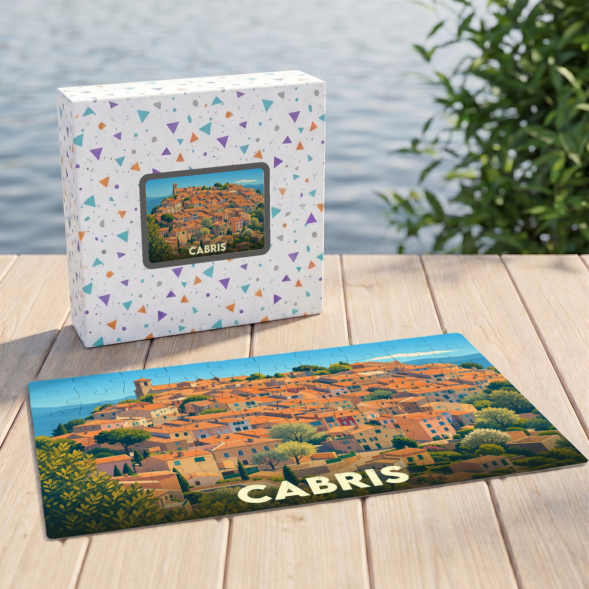 Puzzle souvenir de la ville de Cabris avec une illustration stylisée d'un village provençal.