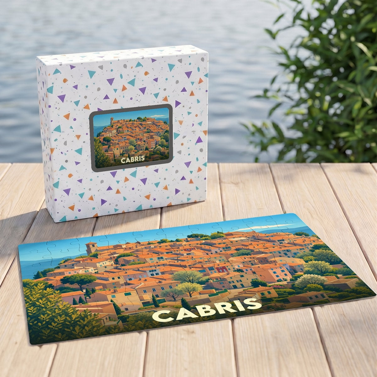 Puzzle souvenir de la ville de Cabris avec une illustration stylisée d'un village provençal.