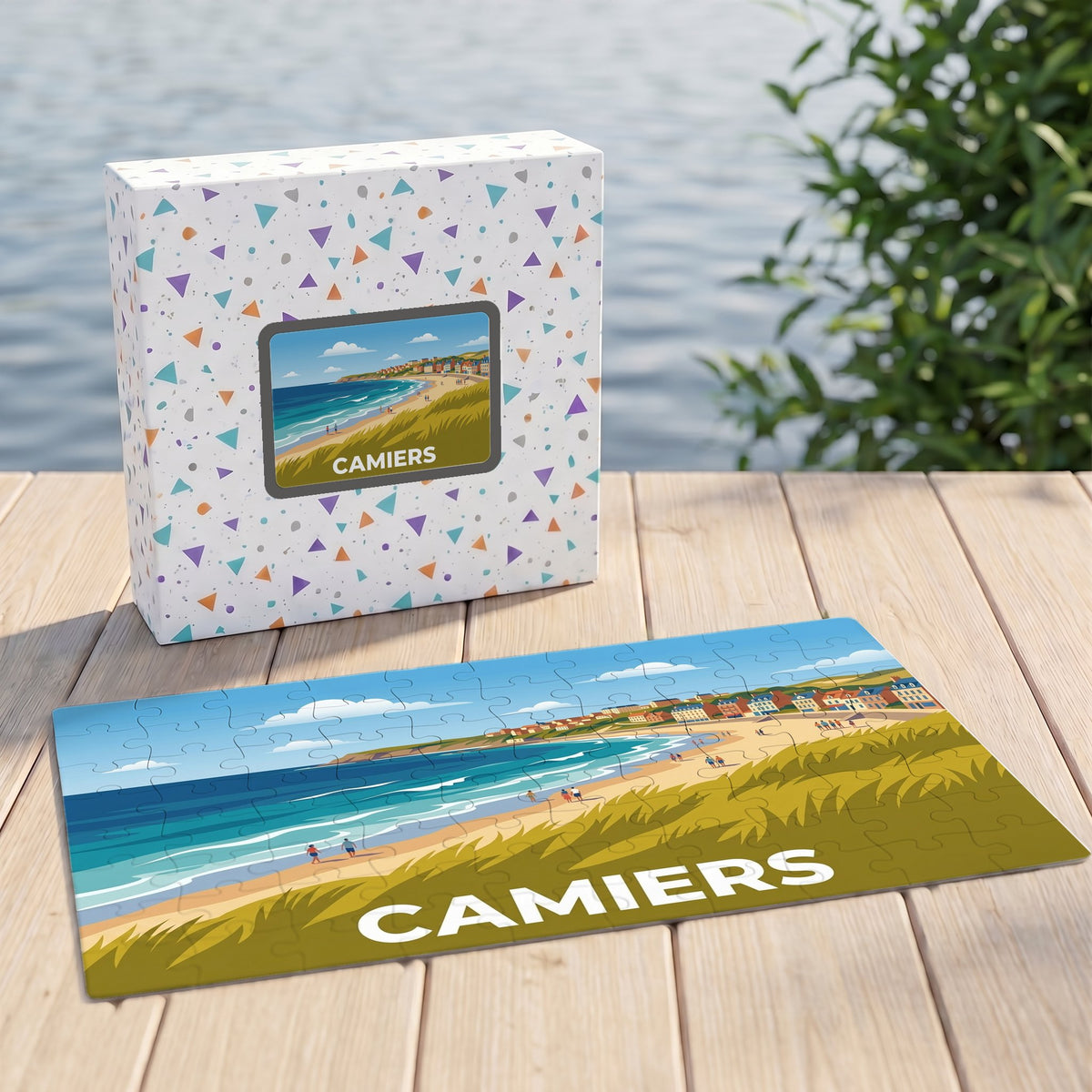 Puzzle souvenir de la ville de Camiers avec une illustration stylisée d'un paysage côtier.