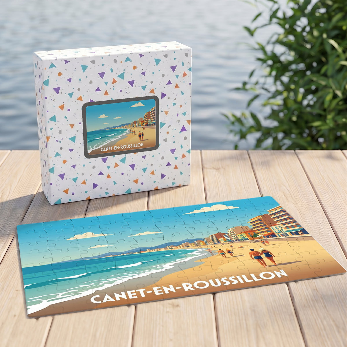 Puzzle souvenir de la ville de Canet-en-Roussillon avec une illustration de plage stylisée et sa boîte assortie.