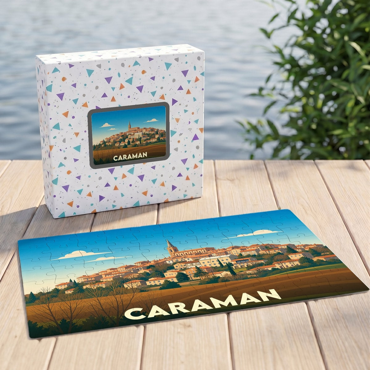 Puzzle souvenir de la ville de Caraman avec une illustration stylisée d'un paysage urbain.