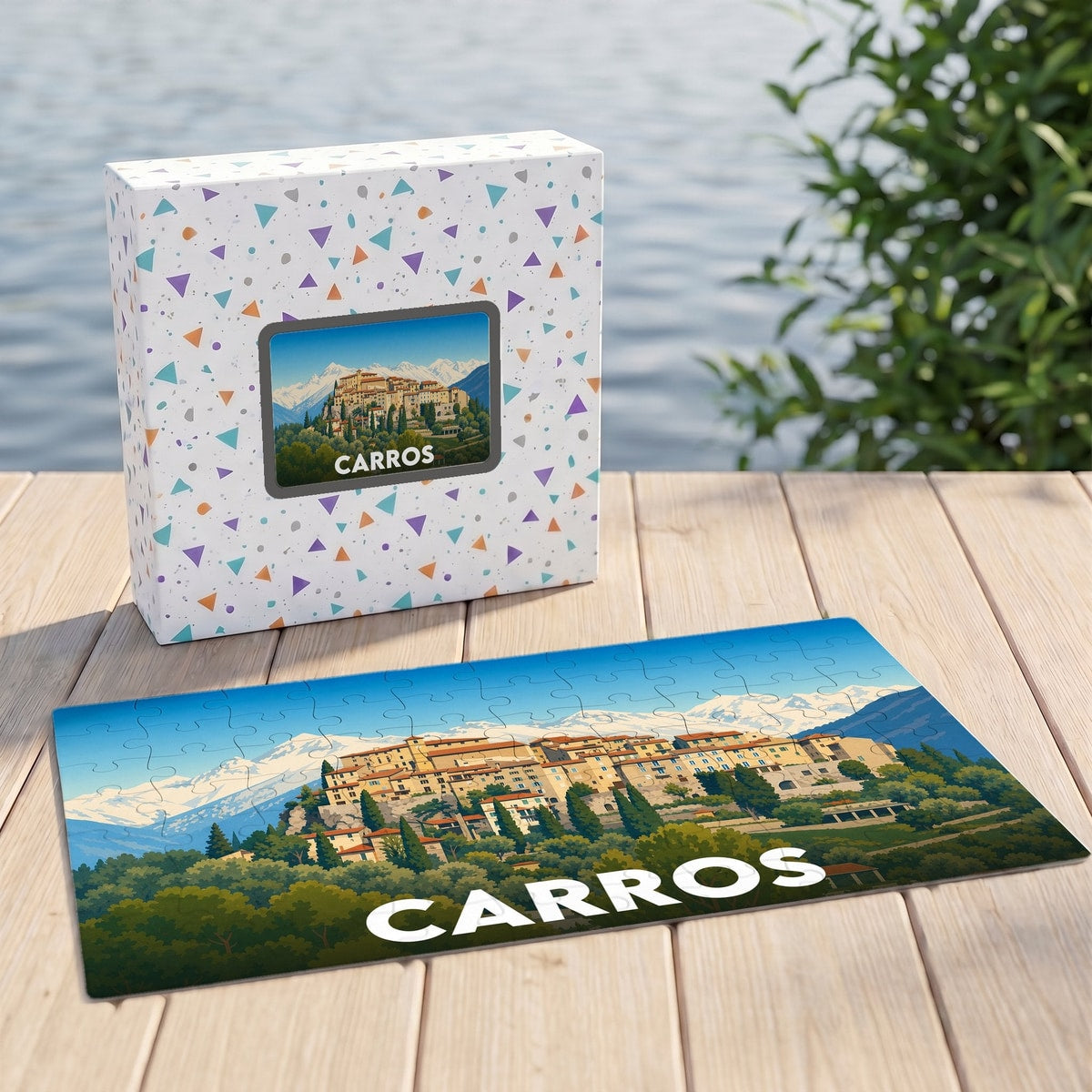 Puzzle souvenir de la ville de Carros représentant une vue panoramique du village et de ses montagnes.