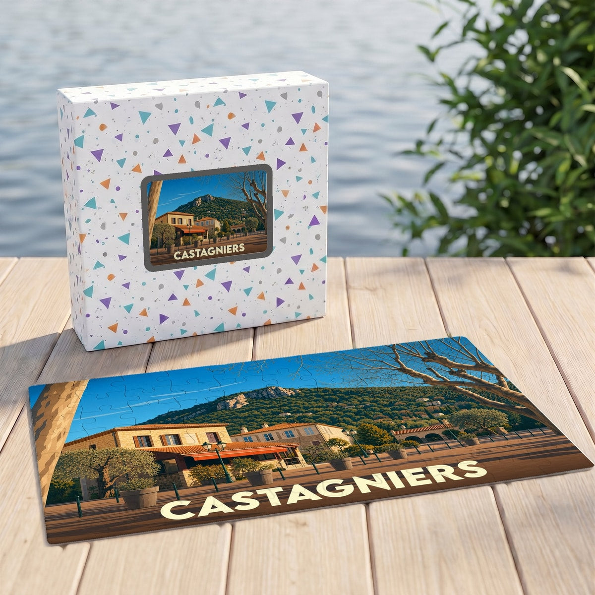 Puzzle souvenir de la ville de Castagniers avec une illustration stylisée d'un paysage provençal.