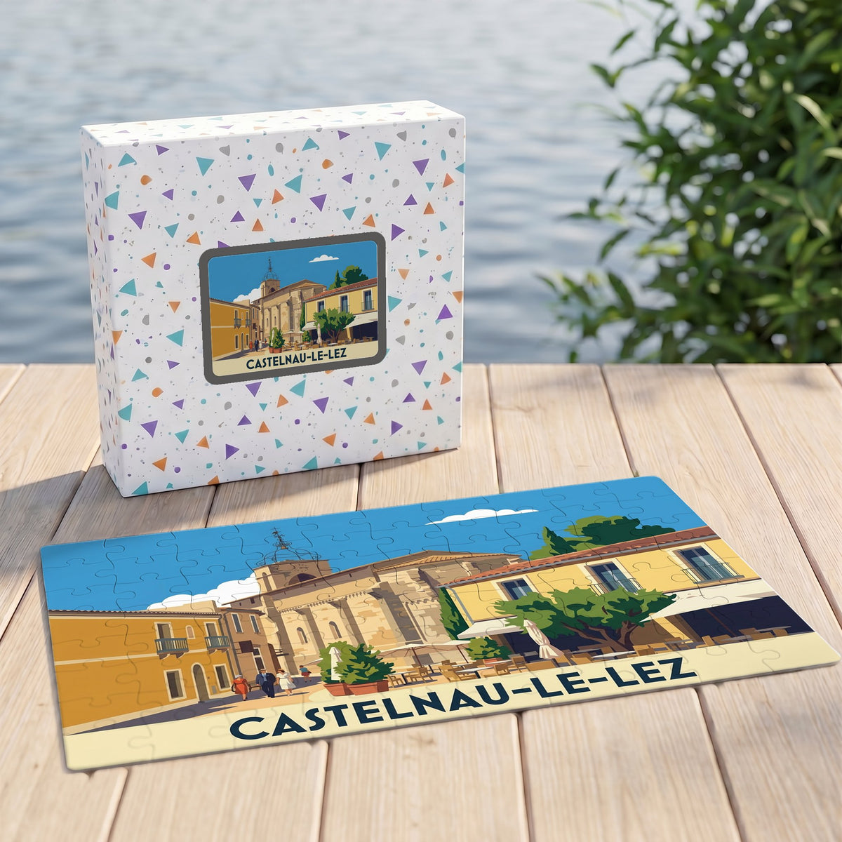 Puzzle souvenir de la ville de Castelnau-le-Lez avec une illustration stylisée et sa boîte assortie.