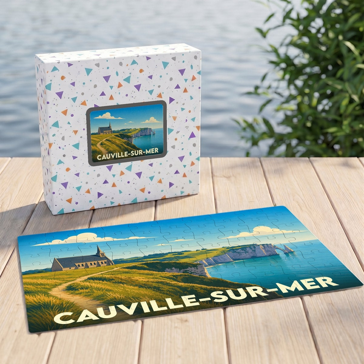 Puzzle souvenir de la ville de Cauville-sur-Mer illustrant une église sur une falaise face à la mer.