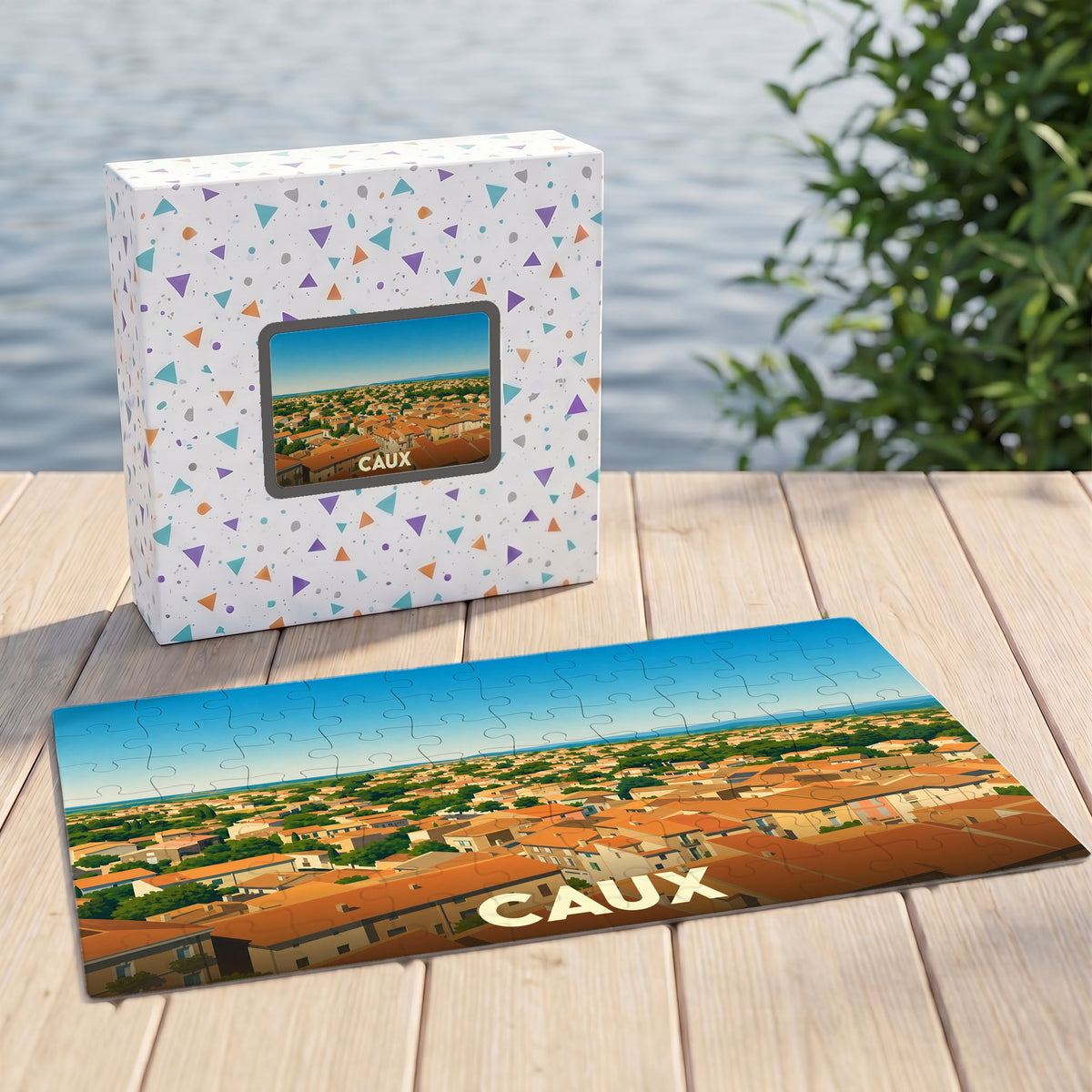 Puzzle souvenir de la ville de Caux représentant une vue aérienne illustrée de ses toits.