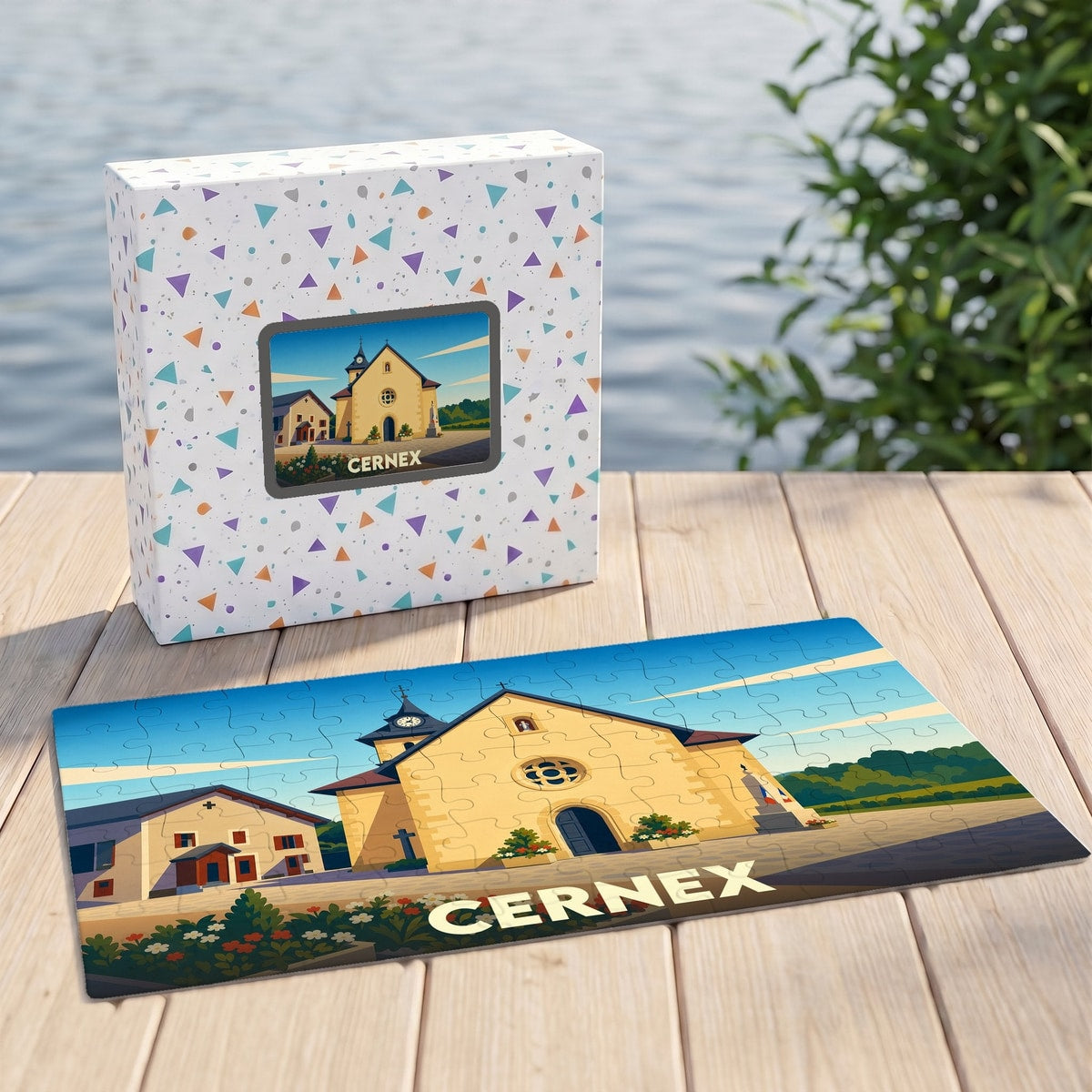 Puzzle souvenir de la ville de Cernex avec une illustration stylisée d'une église sur sa boîte et ses pièces assemblées.